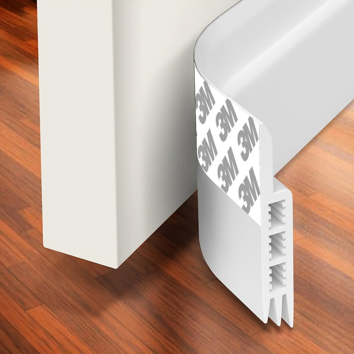 White silicone door draft stopper for improved home comfort, sound insulation, and energy saving.