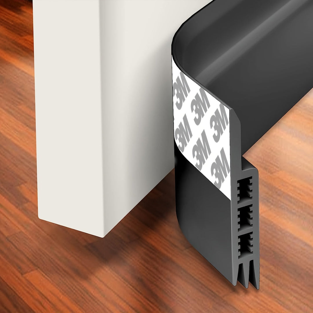 Gray silicone door bottom seal, an energy-saving solution for drafts and sound insulation.