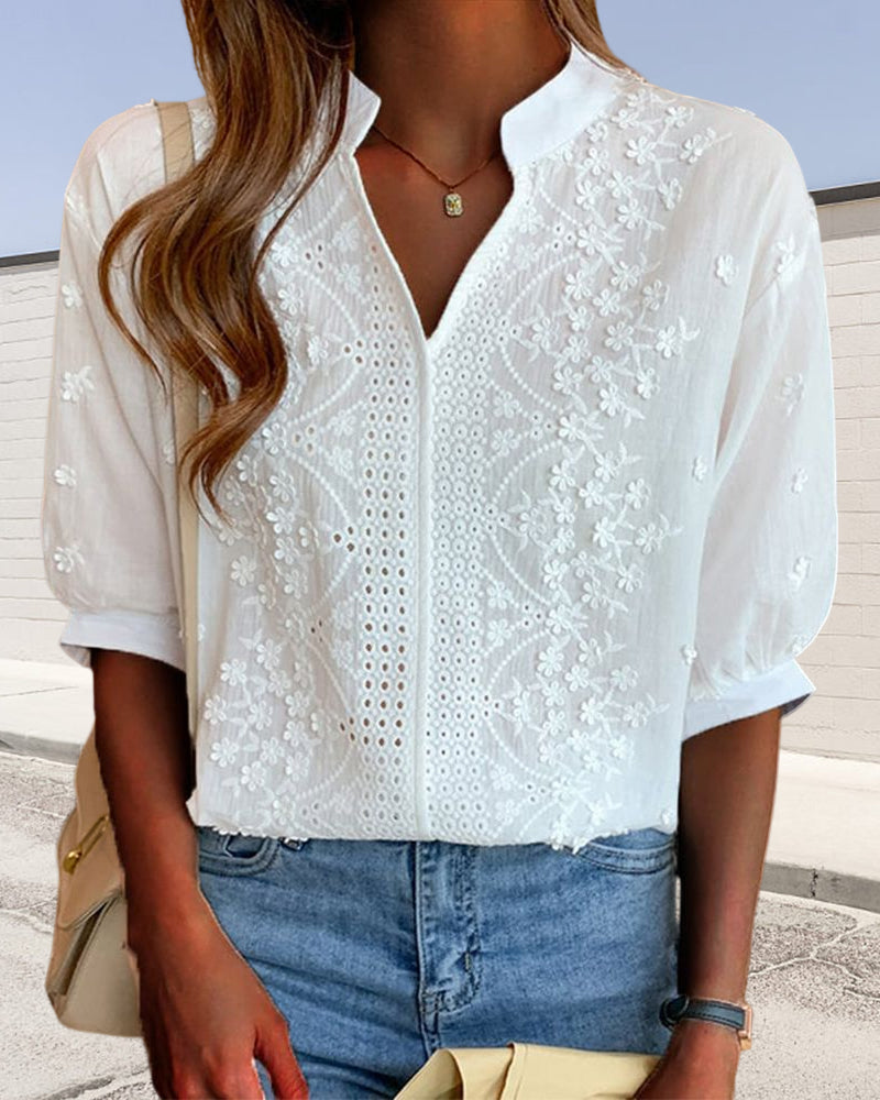 Women's white V-neck blouse with stylish puff sleeves, perfect for summer