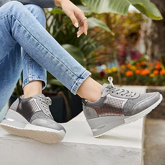 Trendy black women's wedge platform sneakers with a comfortable, elevated design