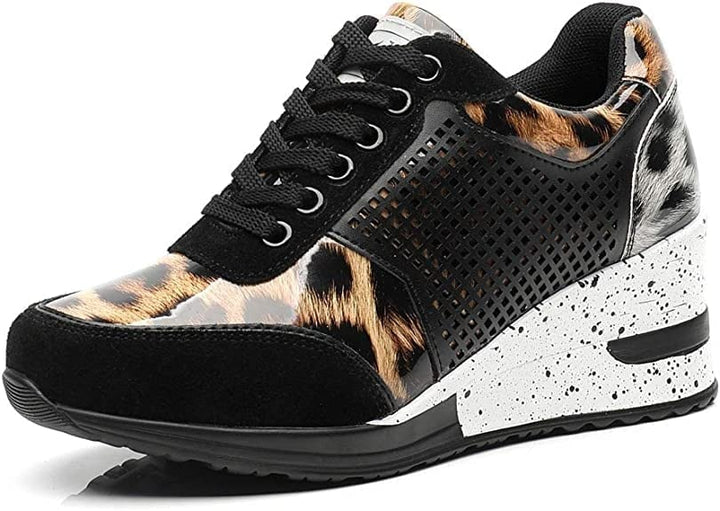 Close-up of the sole of women's elevated platform sneakers, highlighting the wedge design