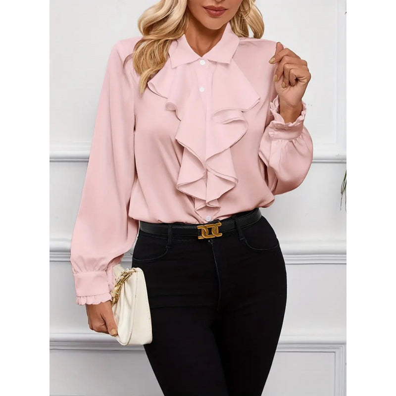 Close-up of the elegant sleeves and delicate ruffles on a stylish women's long-sleeve blouse.