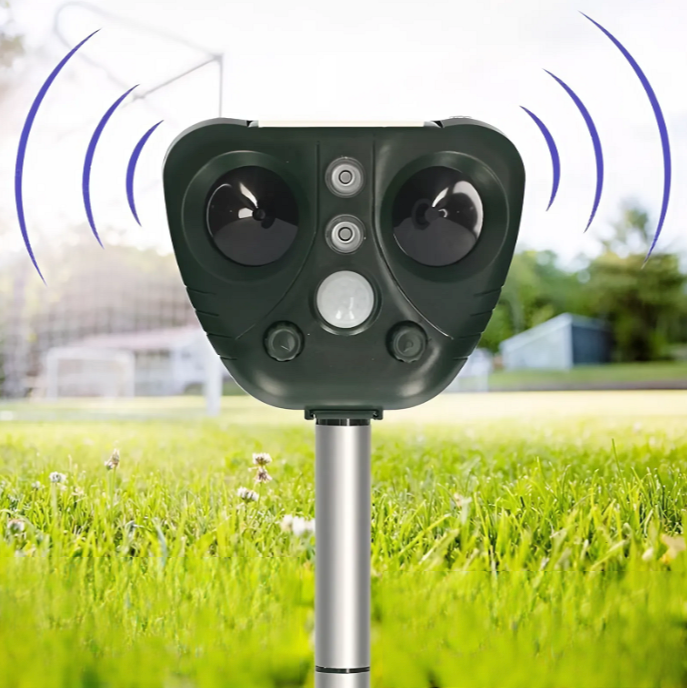 Wireless solar ultrasonic bird repeller for outdoor garden protection. Weatherproof pest control device.