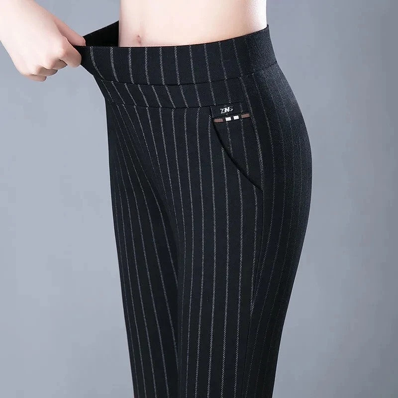 Women's stretchy athleisure pants in black & gray, offering everyday comfort, flexible fit, & casual modern style.