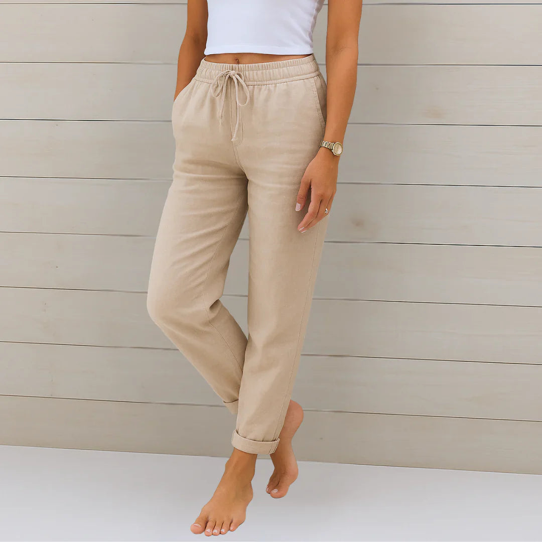 Woman wearing comfortable linen blend stretch trousers in a casual chic style, perfect for summer wear.