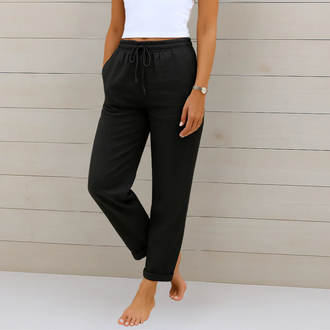 Full-length view of versatile women's stretch pants in a light color, suitable for various occasions.