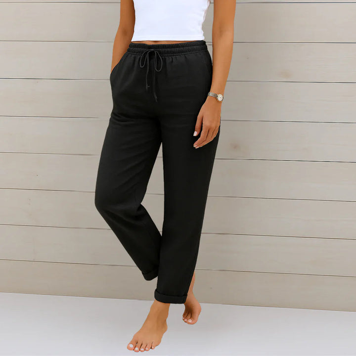 Full-length view of versatile women's stretch pants in a light color, suitable for various occasions.