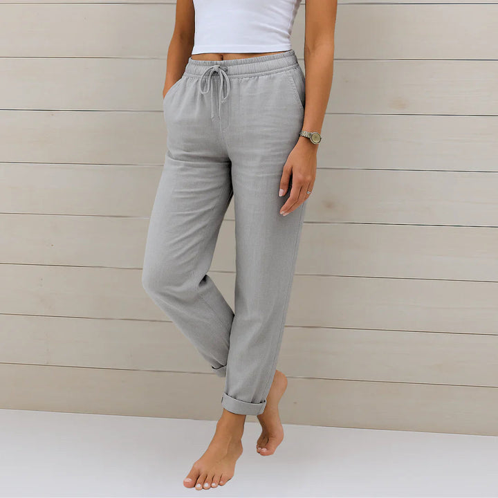 Model showcasing the relaxed fit of women's comfortable linen blend trousers, breathable and chic.