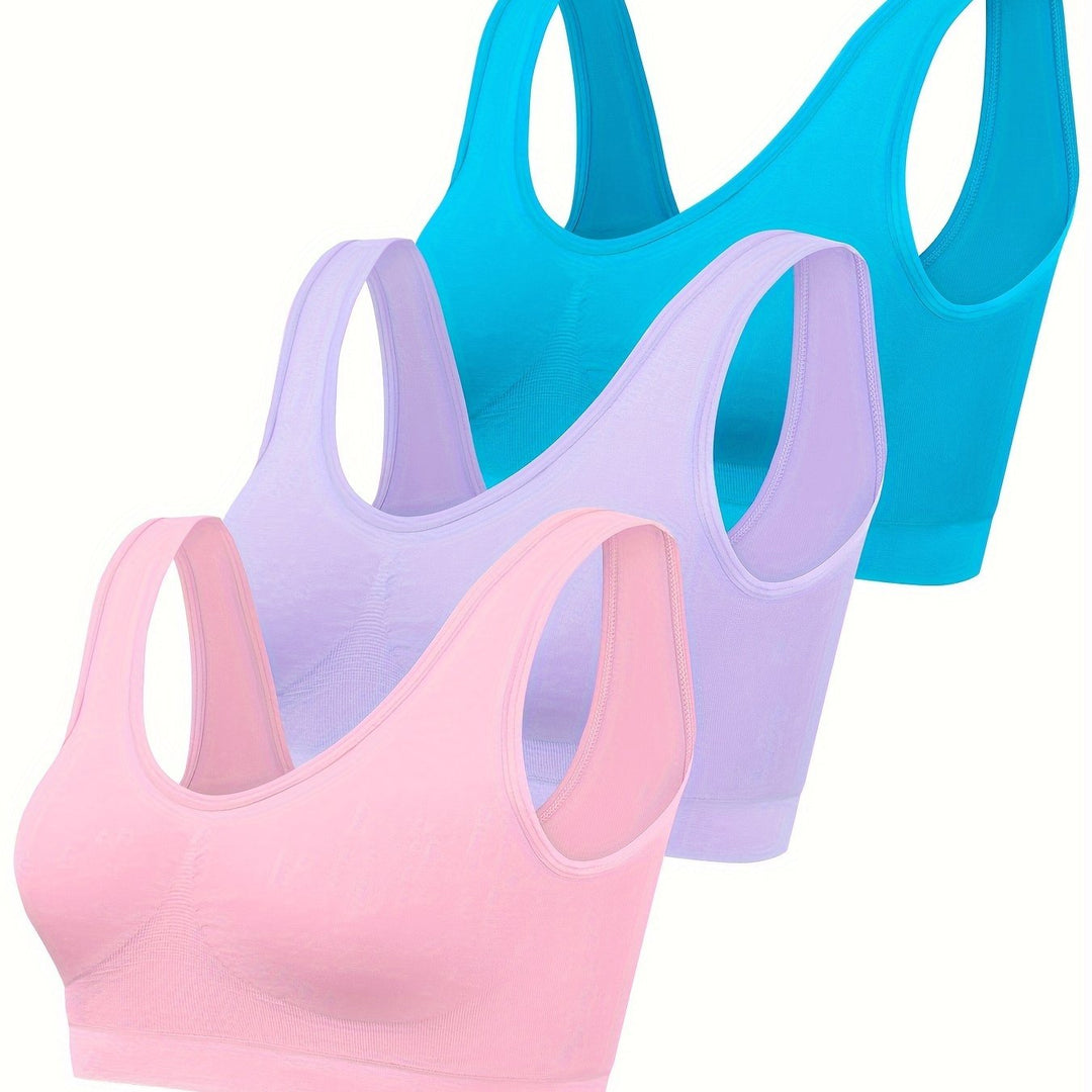Athletic women's 3-piece set: seamless tank top, sports bra, and comfy leggings for training.