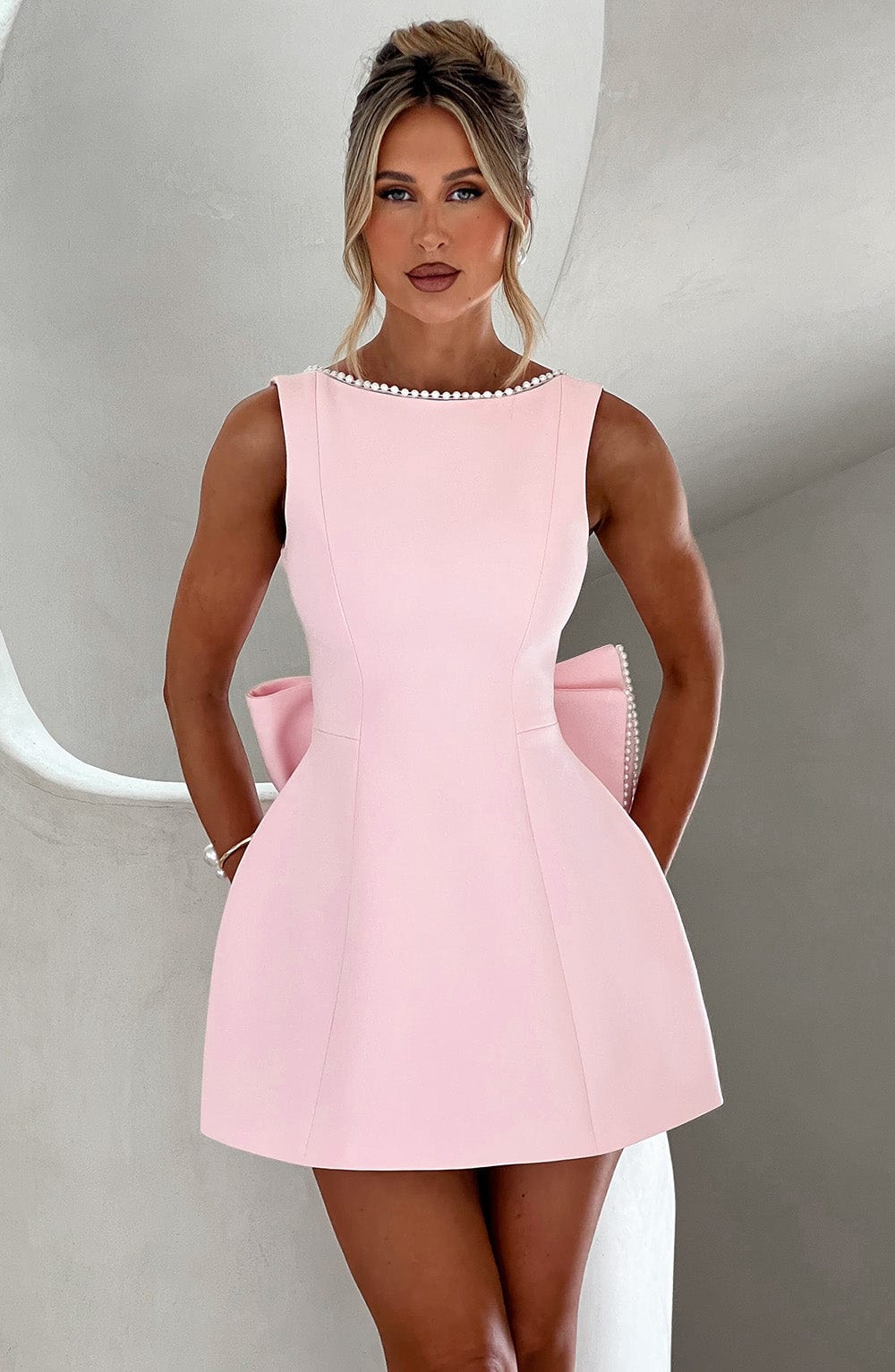 Women's A-line mini dress with elegant pearl trim, perfect for wedding guests & cocktail parties.