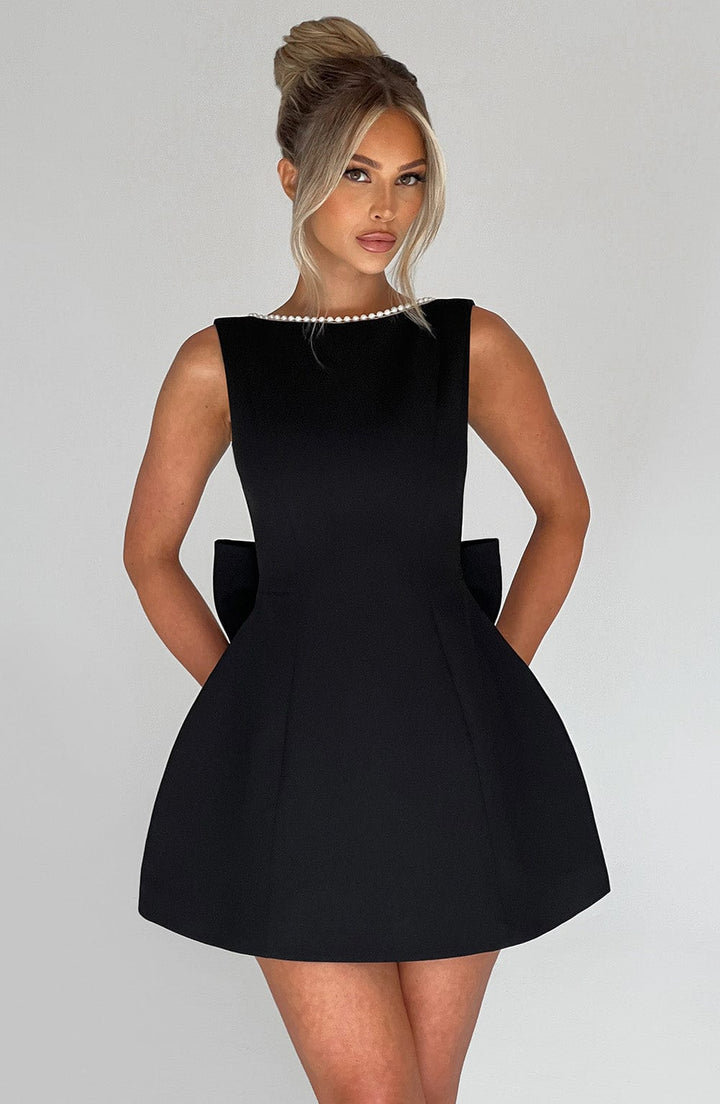 Stylish formal A-line mini dress with pearl accents for wedding guests & summer events. Elegant women's wear.