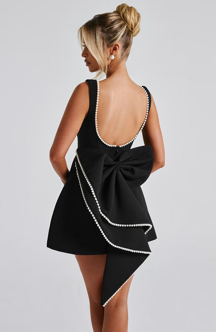 Sleeveless A-line cocktail mini dress for women, featuring exquisite pearl trim. Perfect elegant party dress.