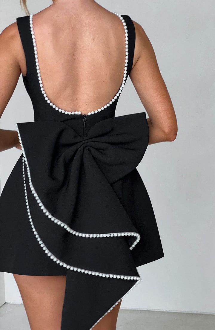 Luxurious women's A-line formal mini dress with pearl trim, a chic & elegant choice for wedding guests.