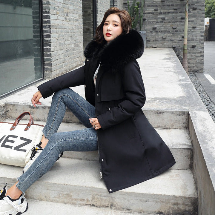 Beige women's Amber parka, a stylish and warm long winter coat for daily wear & cold weather.