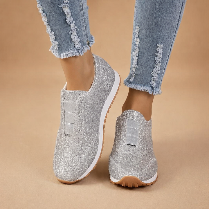 Amelia women's comfort slip-on sneakers. Sparkling glitter footwear for casual, easy-wear everyday fashion.