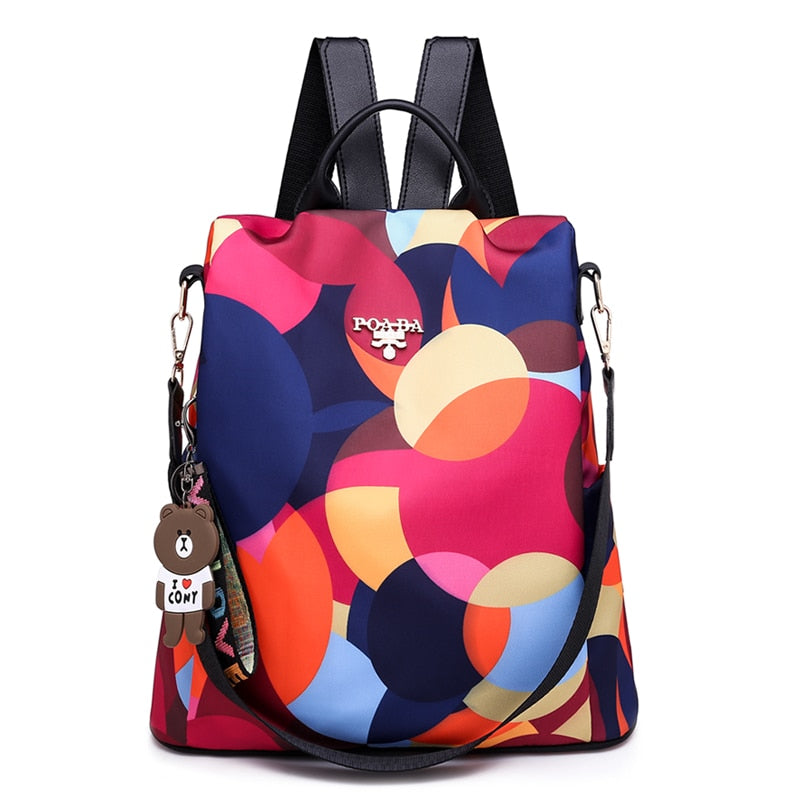 Interior of organized women's anti-theft backpack, water-resistant, multiple compartments for daily essentials.