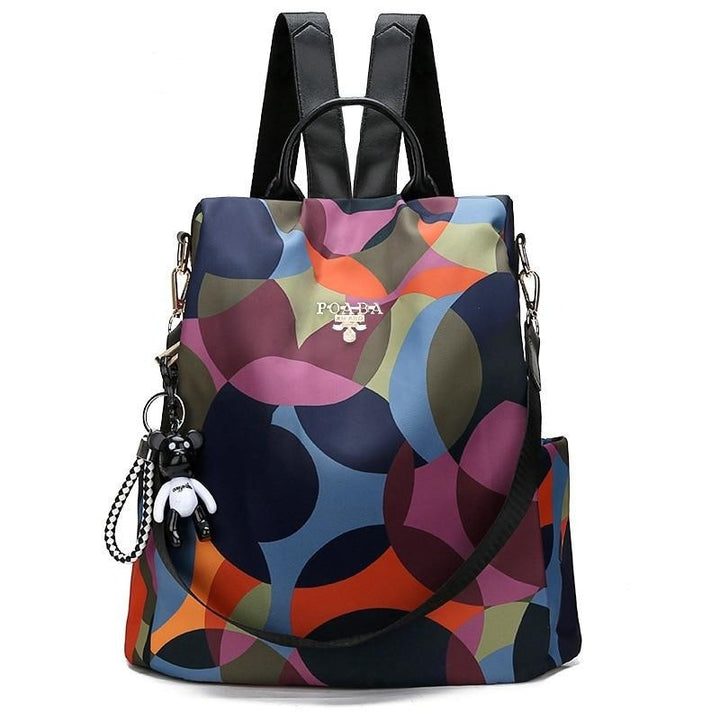 Women's anti-theft backpack, water-resistant, with hidden access for secure travel. Stylish Oxford fabric daypack.