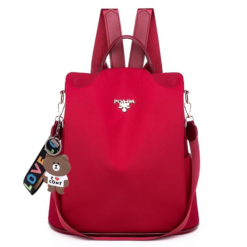 Elegant women's anti-theft daypack, water-resistant Oxford fabric. Secure commuter shoulder bag with hidden access.