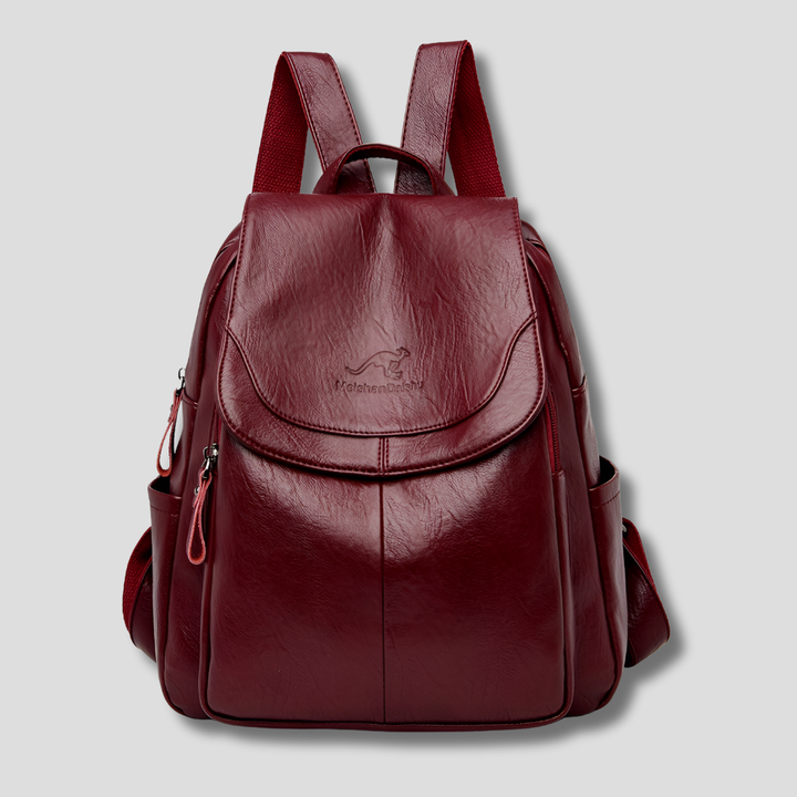 Secure women's travel backpack, embossed black leather, combines style with anti-theft features.