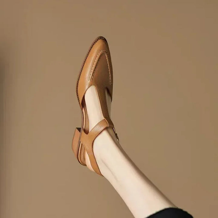 Light brown women's T-strap leather loafers with a stylish buckle, flat and comfortable