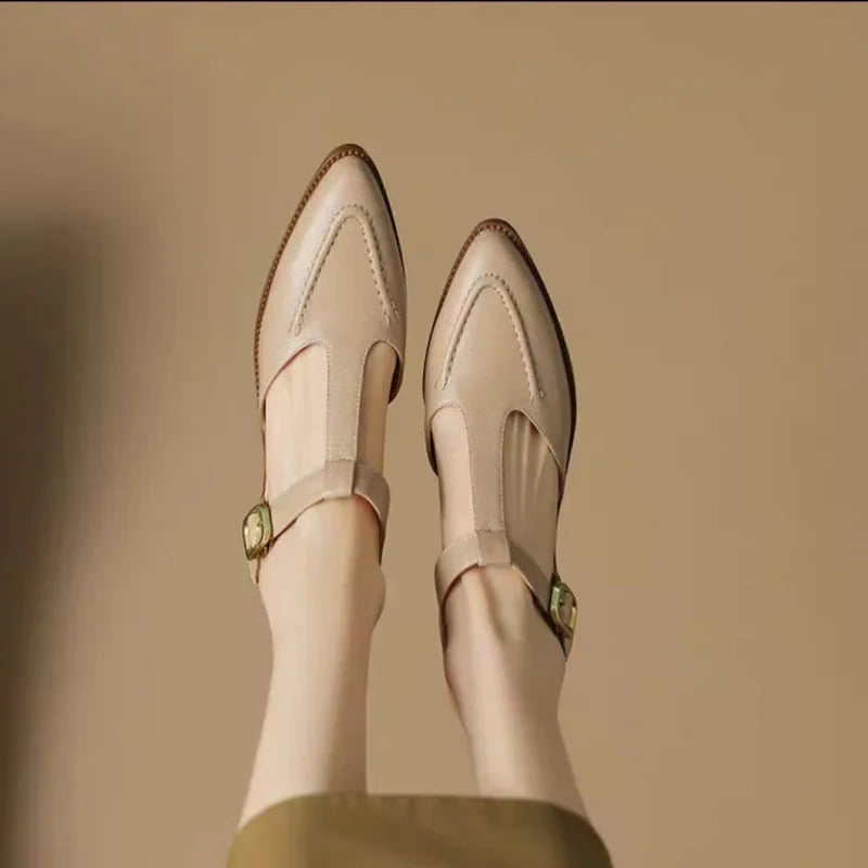 Comfortable women's leather loafers in light brown, featuring a classic buckle and T-strap