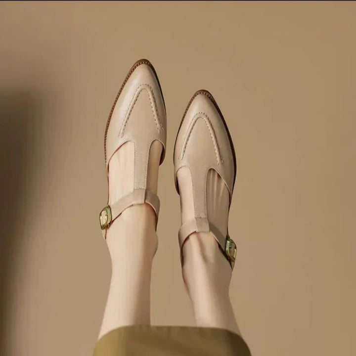 Comfortable women's leather loafers in light brown, featuring a classic buckle and T-strap