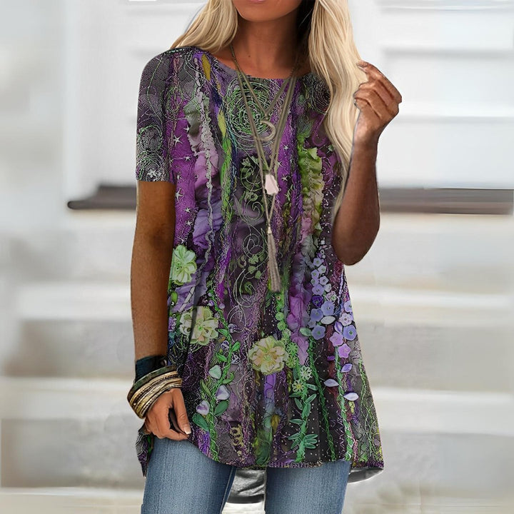 Ladies' round neck short sleeve blouse with vibrant artistic print, a comfortable and stylish choice for summer.