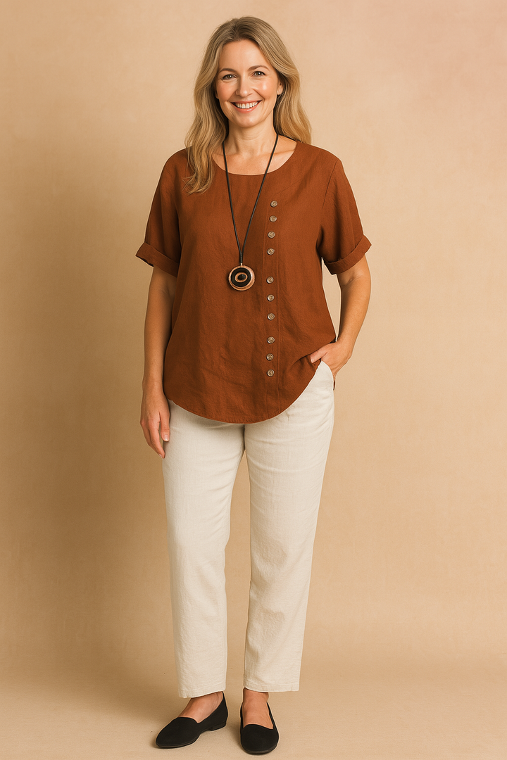 Modern women's blouse, featuring an asymmetrical hem and stylish buttons, comfortable short sleeve.