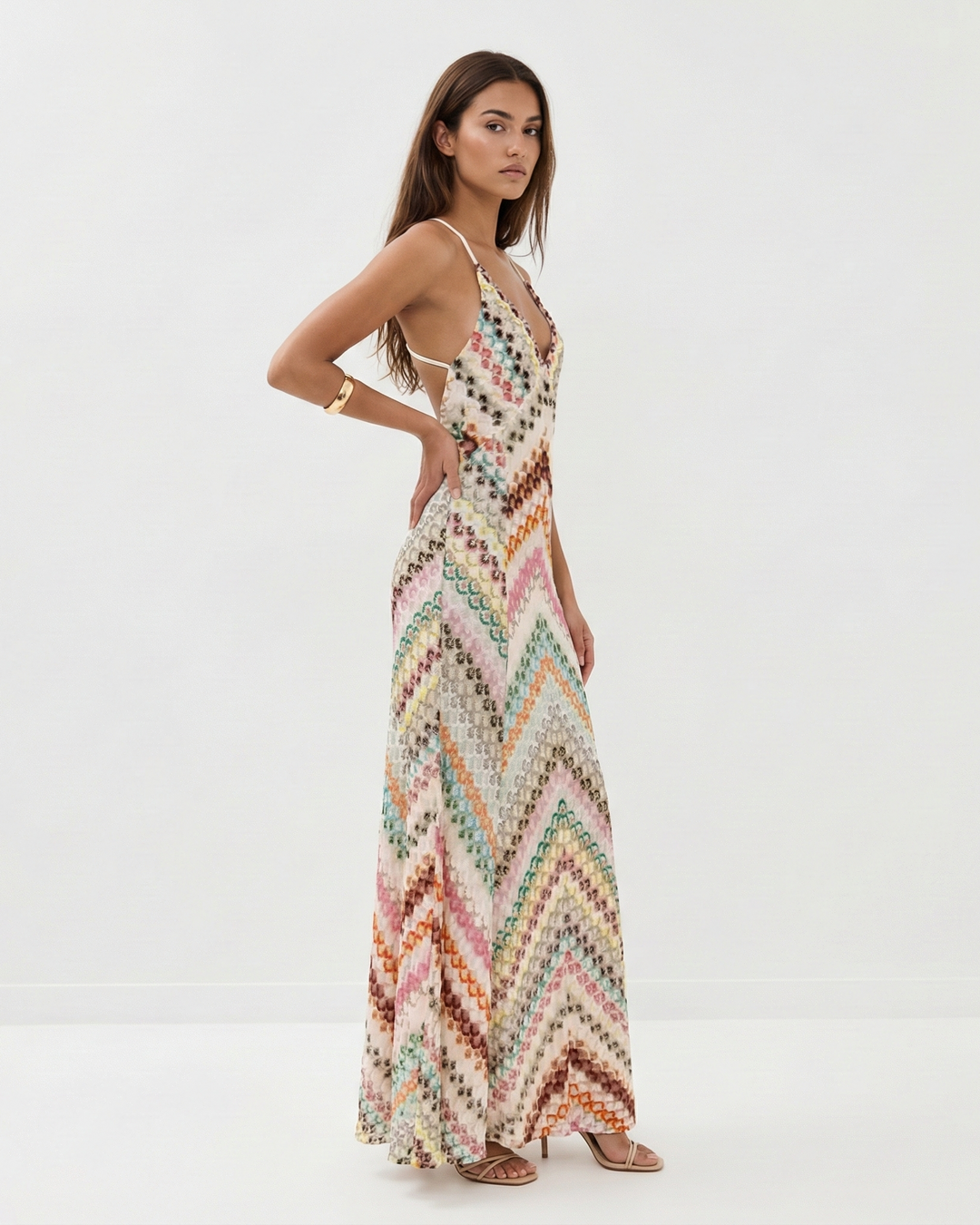 Stylish women's striped spaghetti strap maxi dress with a flattering V-neck and backless design.