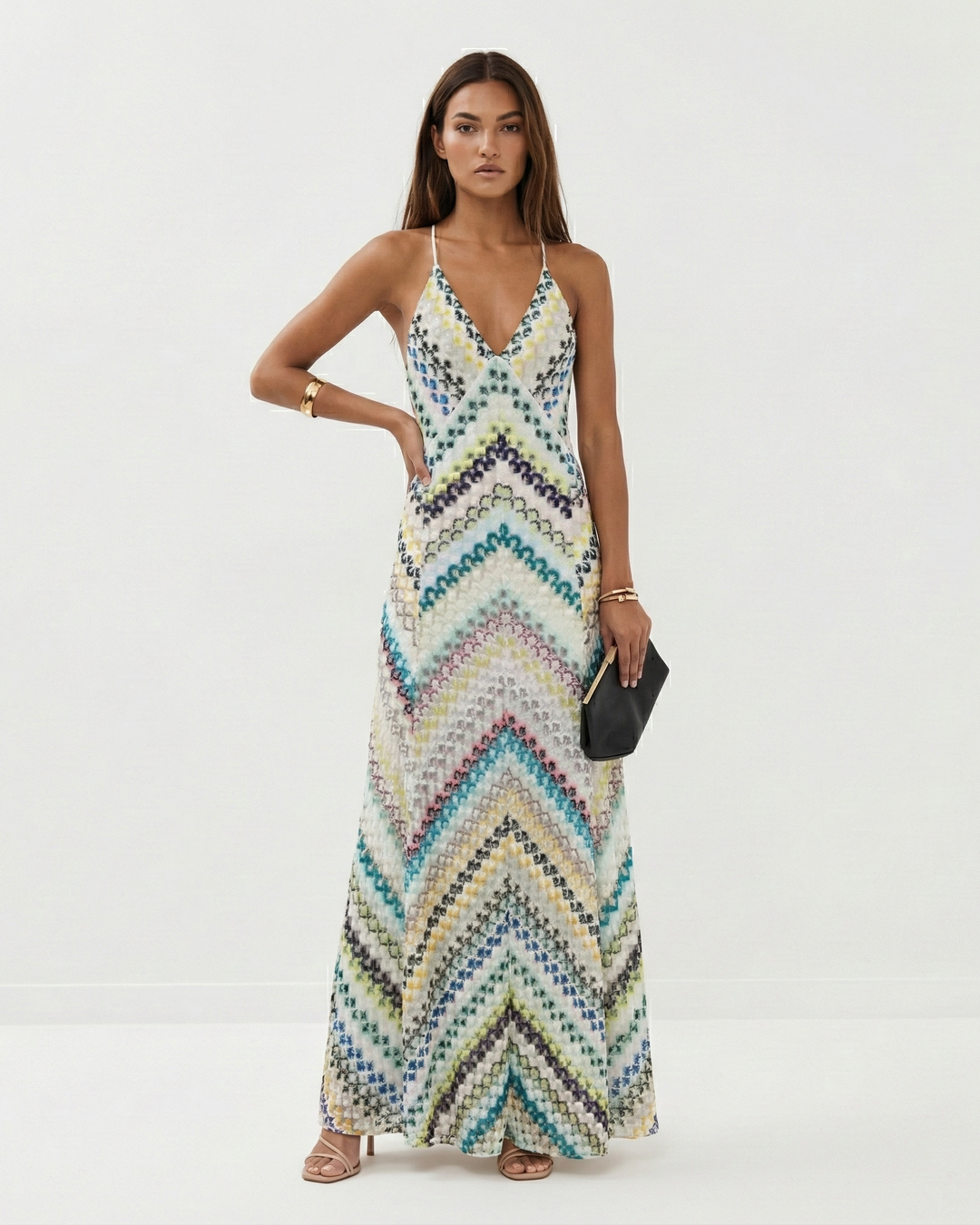 Fashionable women's backless striped maxi dress for summer evenings, resort trips, or special events.