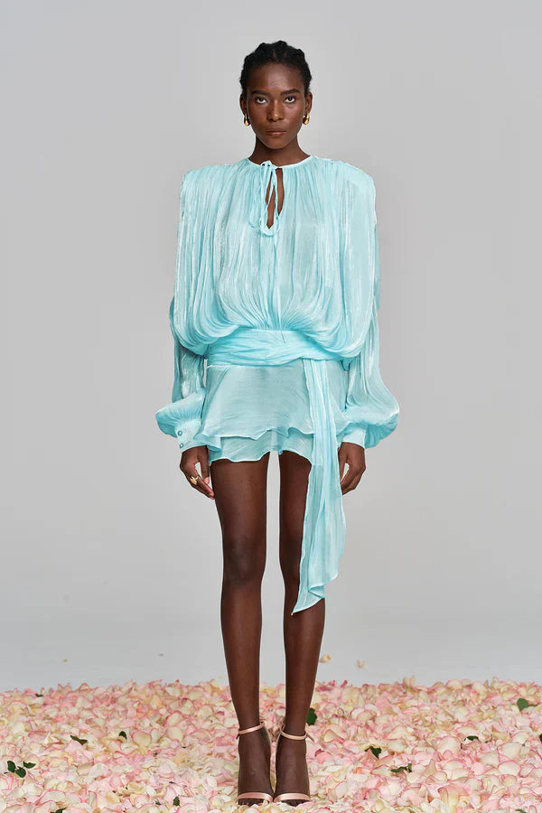 Full length shot of a women's party-ready balloon sleeve ruffle mini dress, embodying summer elegance