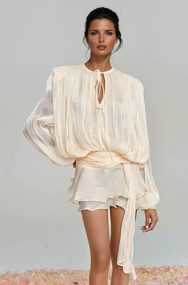Elegant women's mini dress with voluminous balloon sleeves and delicate ruffles, ideal for summer events