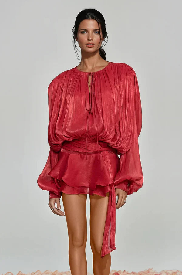 Model wearing a vibrant balloon sleeve ruffle mini dress, showcasing its flowy design and party-ready style