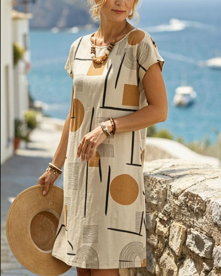 Elegant women's shift mini dress featuring a modern abstract geometric print. Casual beige short sleeve day dress style.