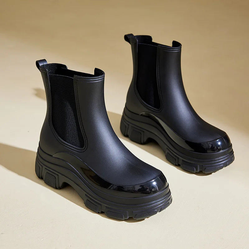 Fashionable black women's chunky sole ankle boots, versatile casual winter footwear.