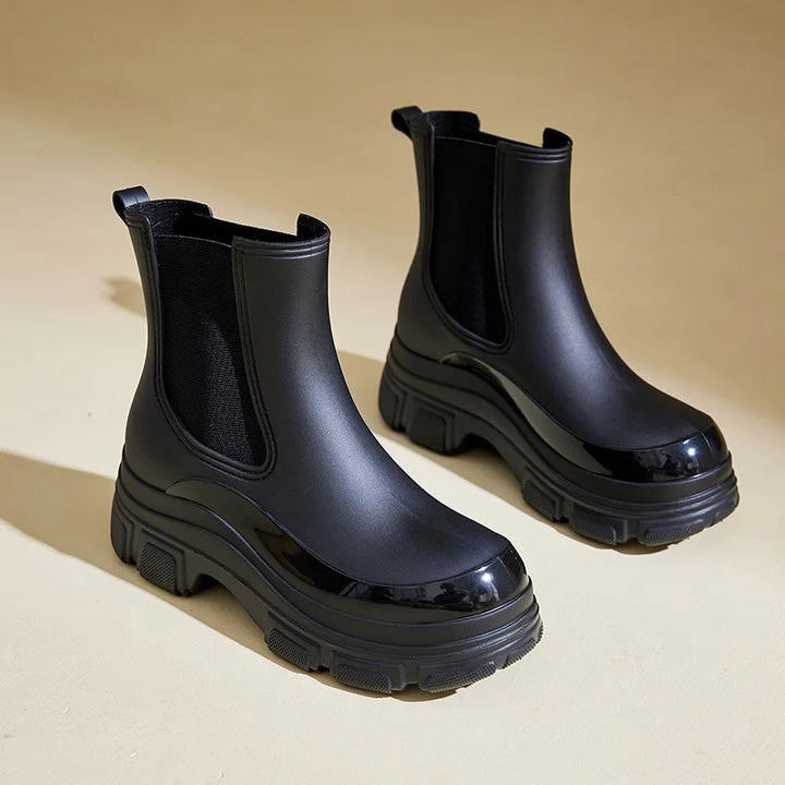 Fashionable black women's chunky sole ankle boots, versatile casual winter footwear.