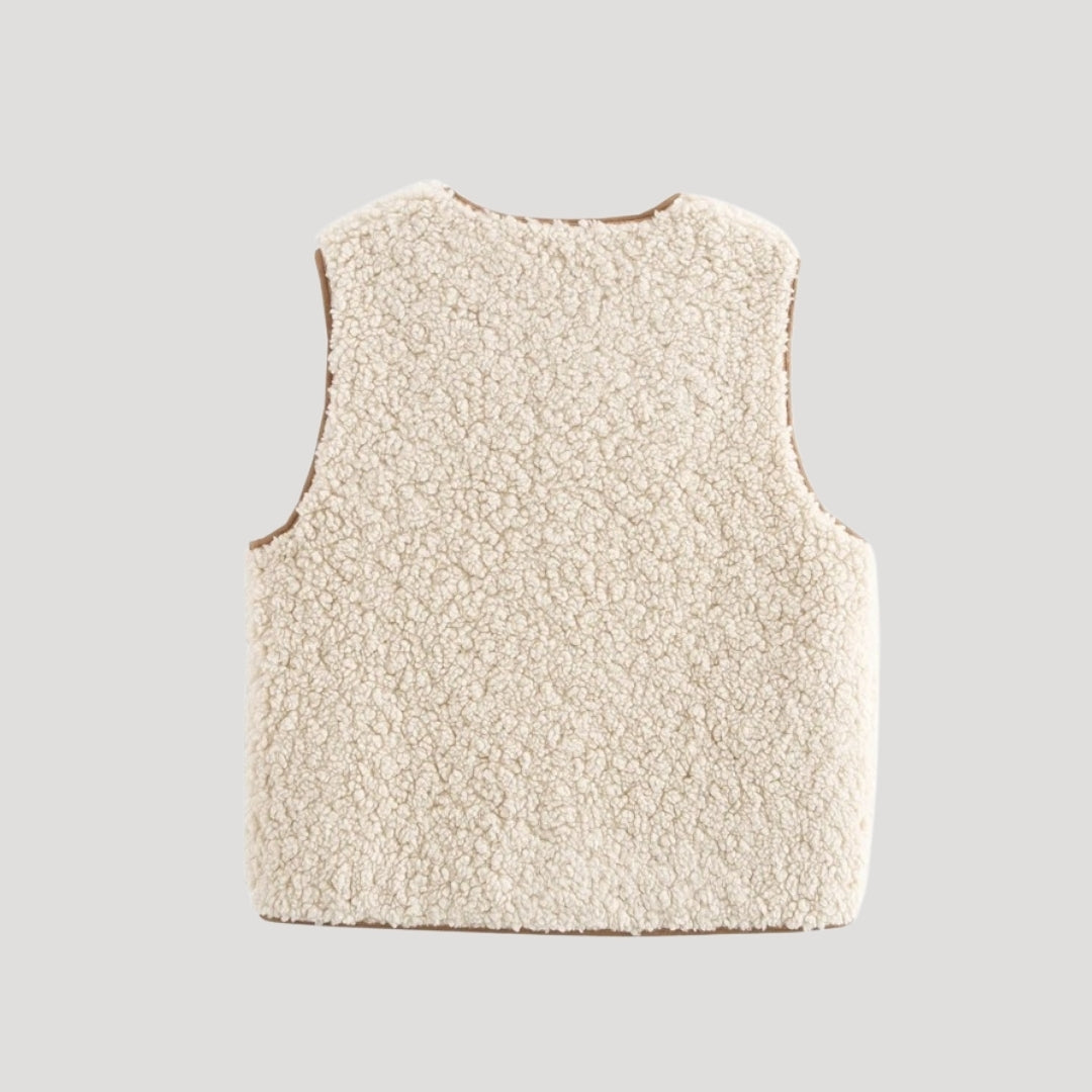Close-up of a comfortable women's sleeveless beige vest with tie-front detail, ideal for spring fashion