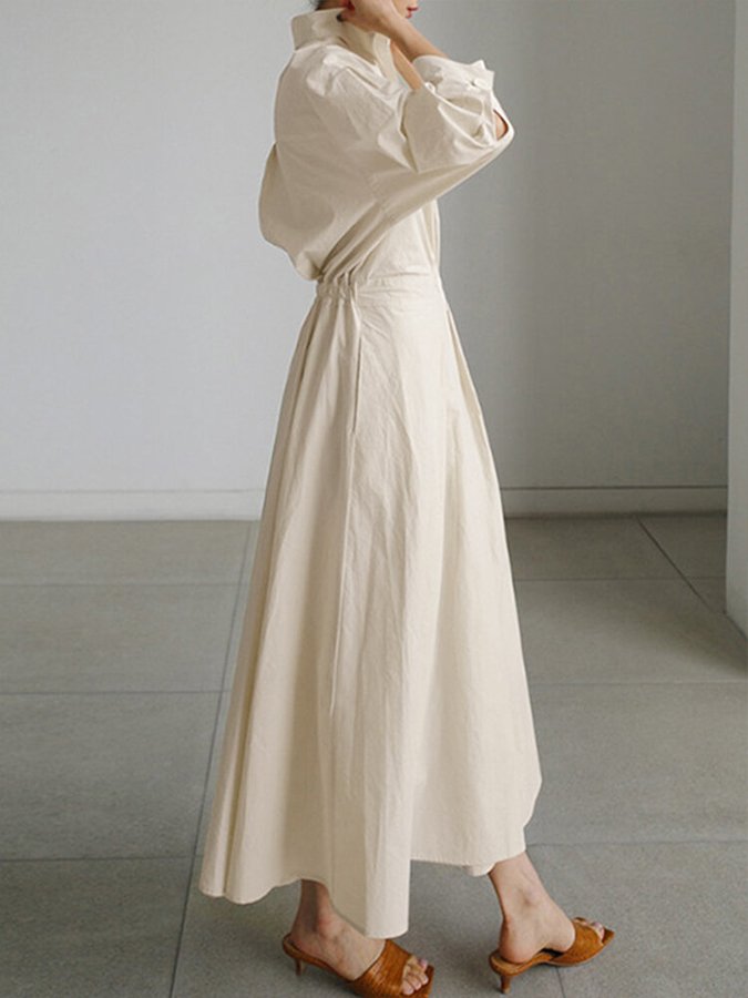 Elegant women's long shirt dress with belt and pockets, versatile for casual or dressed-up occasions