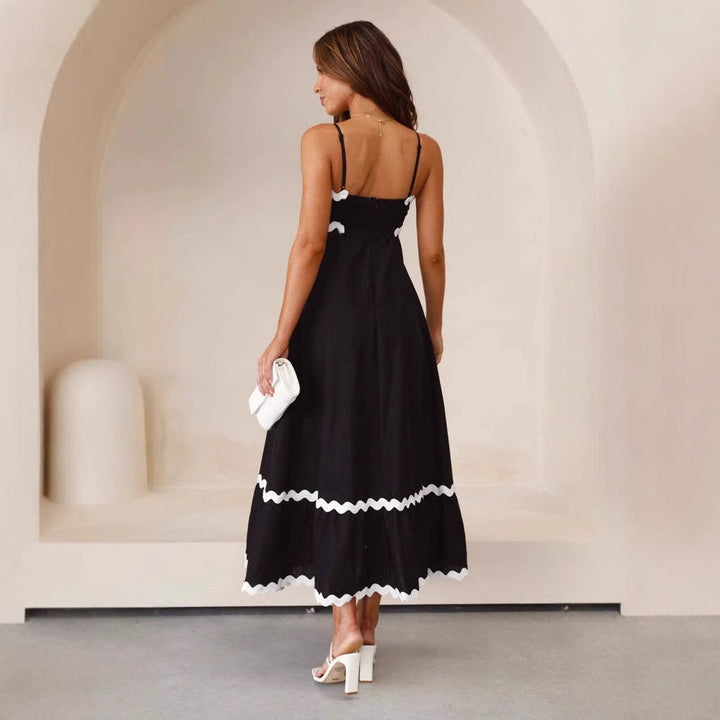 Front view of a women's A-line maxi dress with spaghetti straps, showcasing its flowing silhouette.