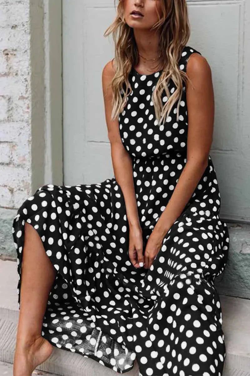 Stylish women's casual midi dress featuring a timeless polka dot design, sleeveless for comfort