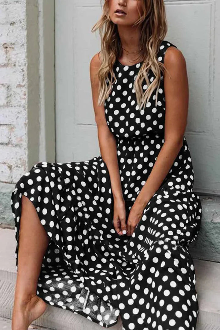 Stylish women's casual midi dress featuring a timeless polka dot design, sleeveless for comfort