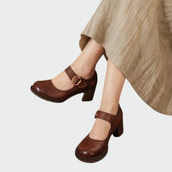 Women's black chunky-heel Mary Jane shoes with buckle closure, classic elegant style