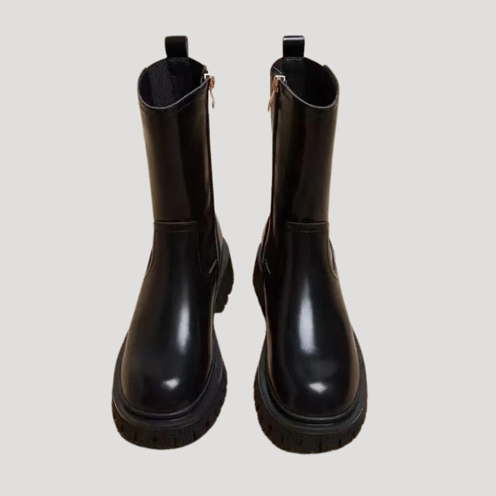 Stylish women's chunky platform mid-calf boots in black, ideal for spring outfits.