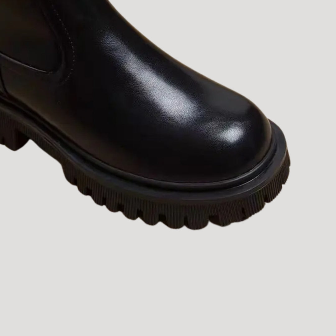 Fashionable women's mid-calf boots with chunky sole, versatile for spring styling.