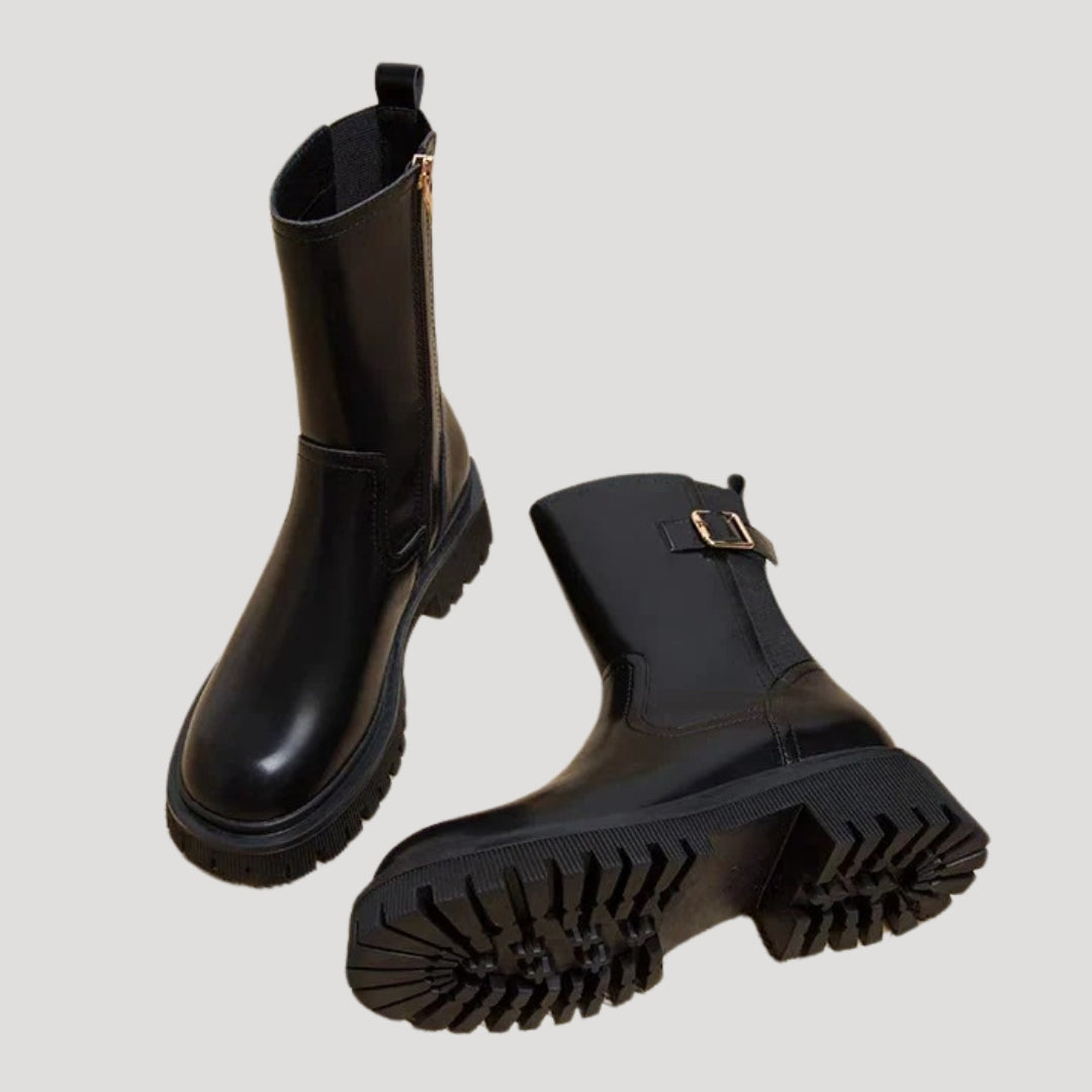 Side view of a women's black chunky boot, featuring mid-calf height and comfortable fit.