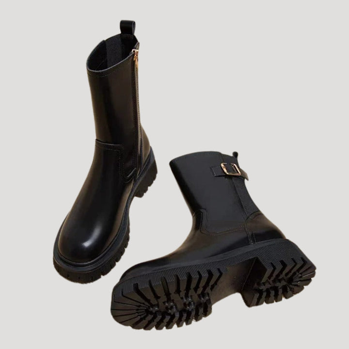 Side view of a women's black chunky boot, featuring mid-calf height and comfortable fit.