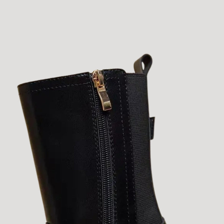 Women's spring fashion boots: black chunky mid-calf design with robust platform.