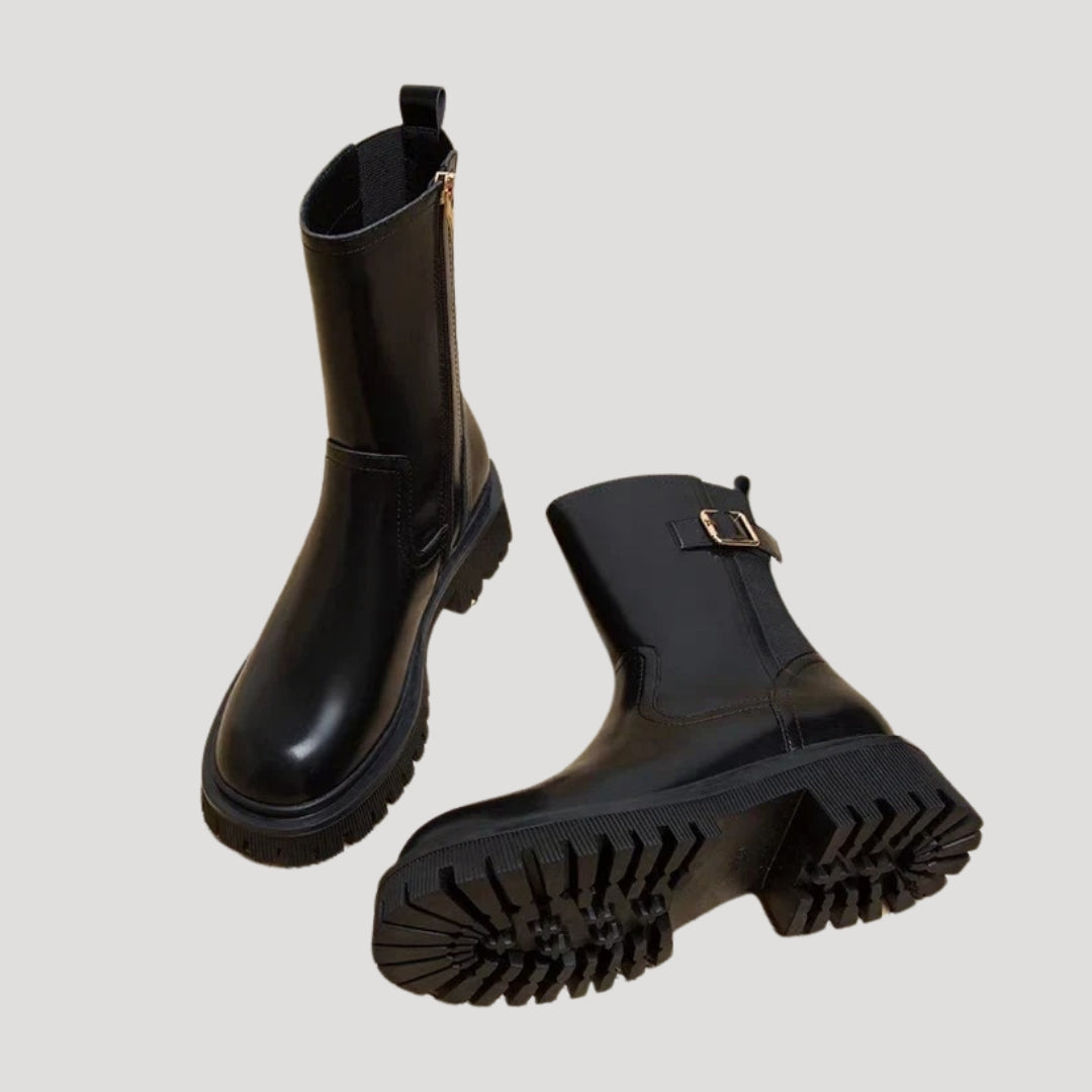 Trendsetting women's chunky mid-calf boots in black, suitable for various spring occasions.