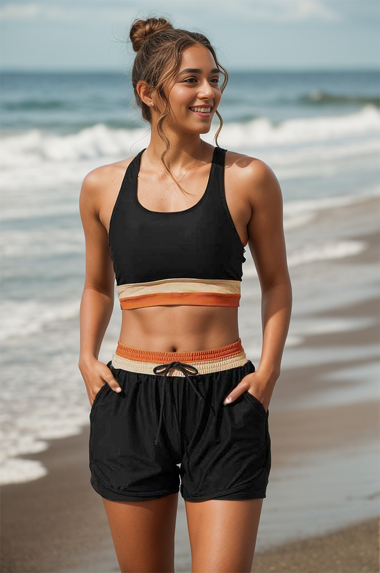 Durable women's black colorblock sport bikini with secure racerback top & high-waist boyshorts, ideal for activewear.