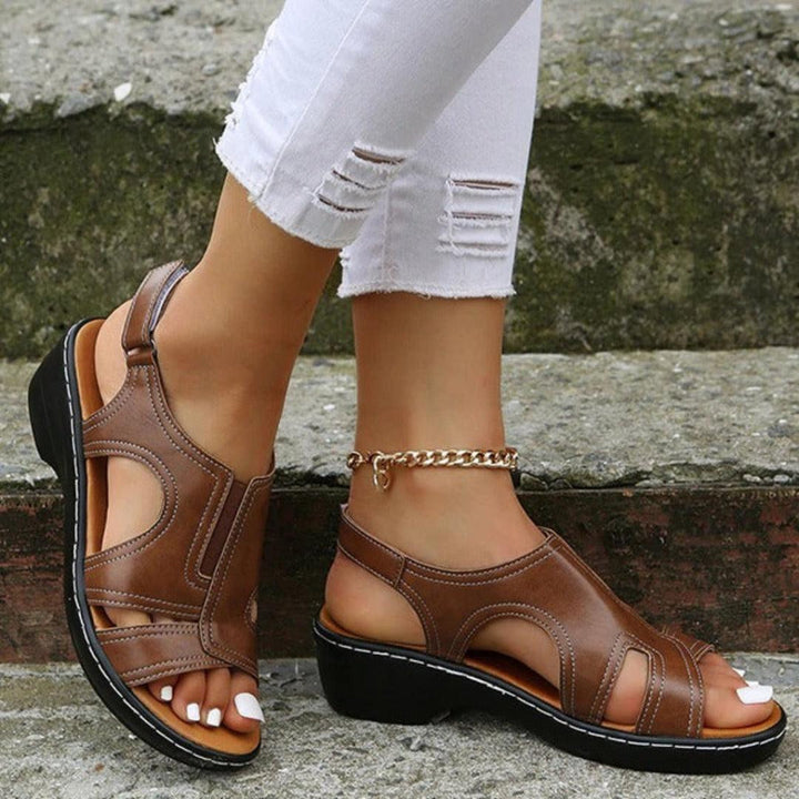 Fashionable women's cutout platform sandals in a neutral color, great for warm weather.